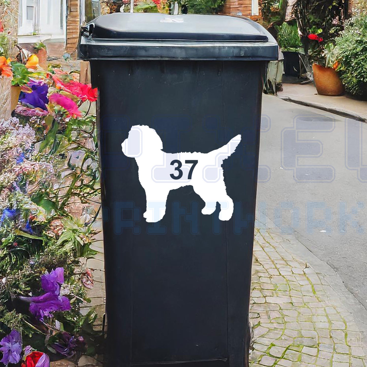 Personalised Cockapoo wheelie bin sticker showing a fluffy Cockapoo silhouette with cut-out house number on a bin outside a UK home by Pixel Printworks