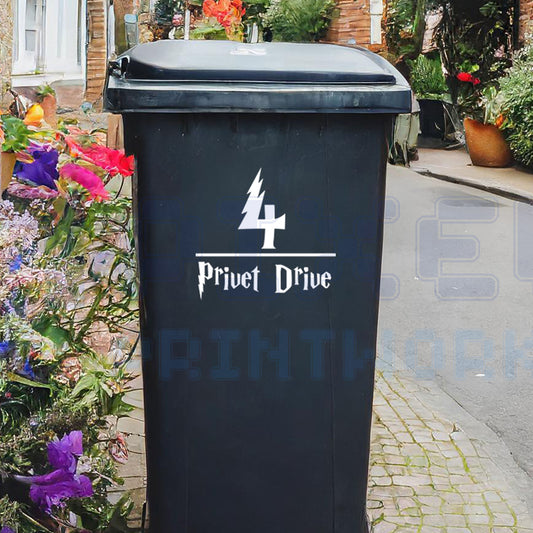 Personalised magical wizard wheelie bin sticker showing house number and street name on a bin in a charming UK residential street with flowers and traditional homes by Pixel Printworks