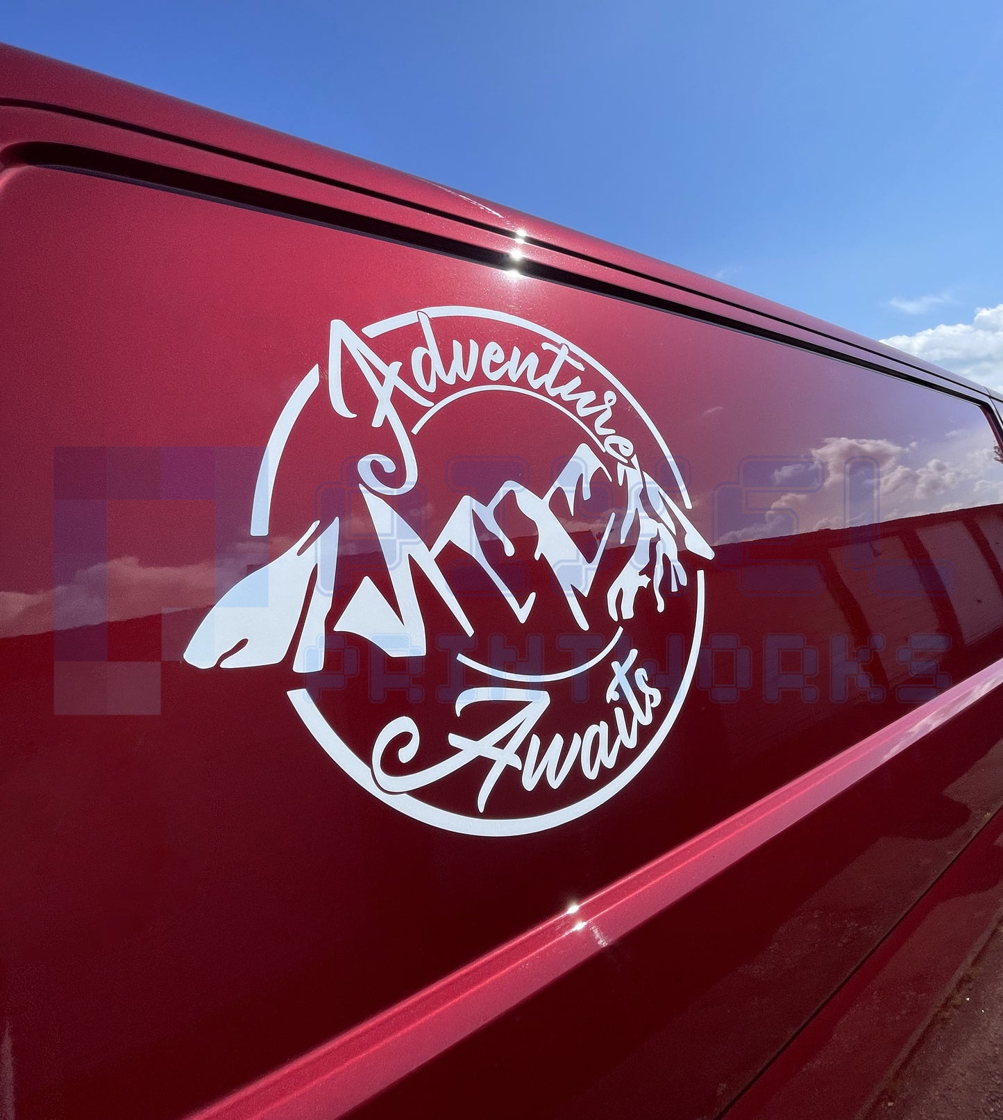 Adventure Awaits script mountain vinyl decal displayed on campervan door by Pixel Printworks