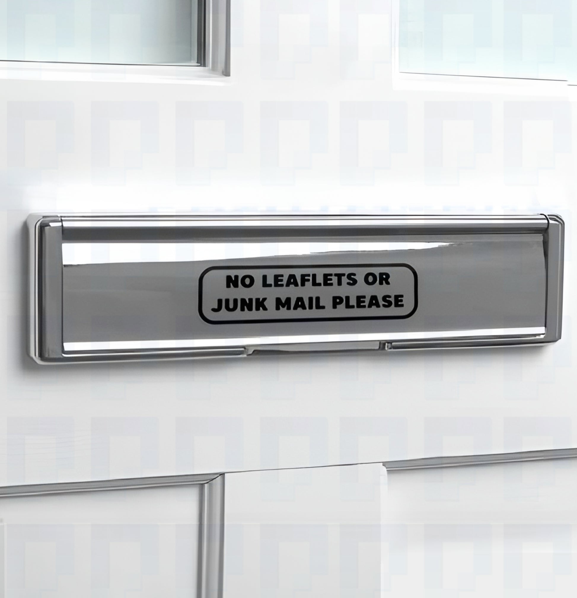 No Leaflets or Junk Mail vinyl letterbox sticker applied to silver mailbox slot on white front door