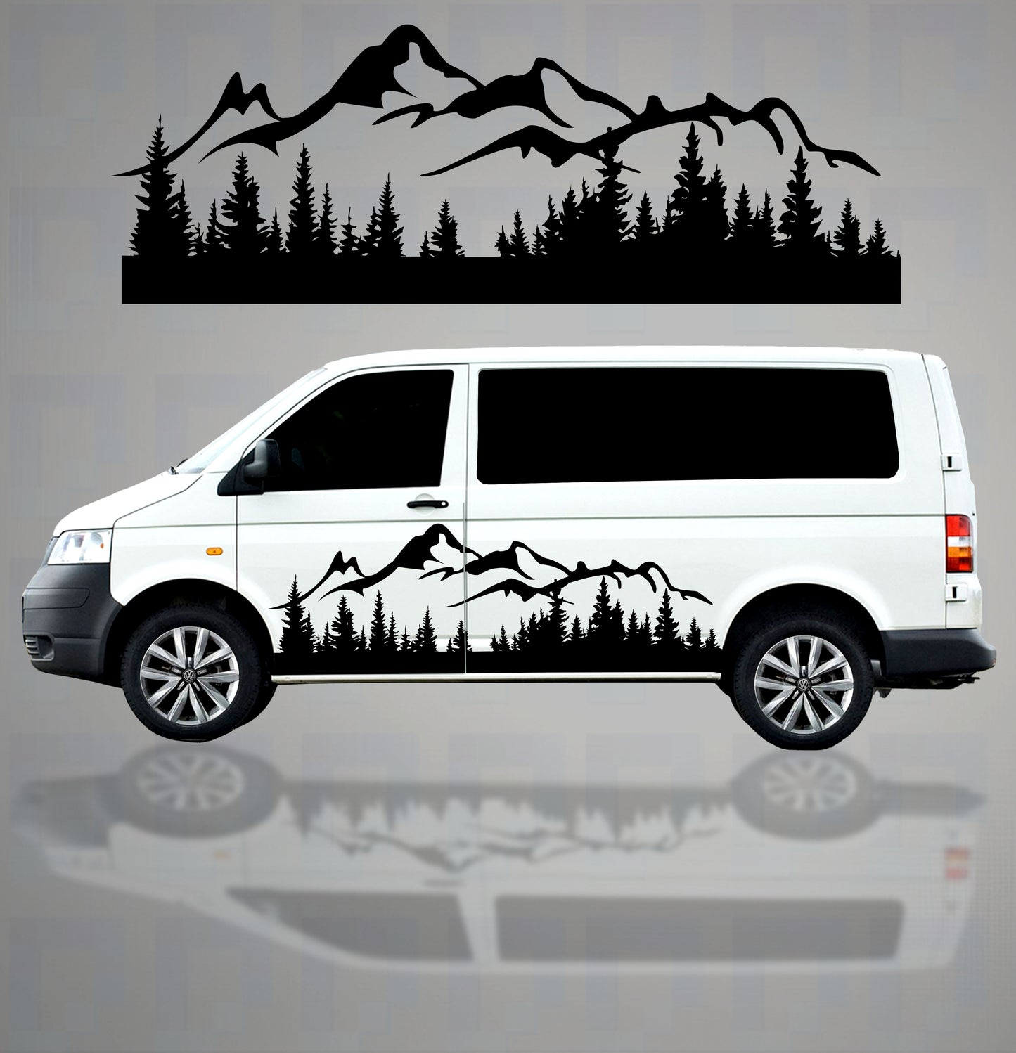 Mountain and tree vinyl decals applied to the side of a short wheel base campervan