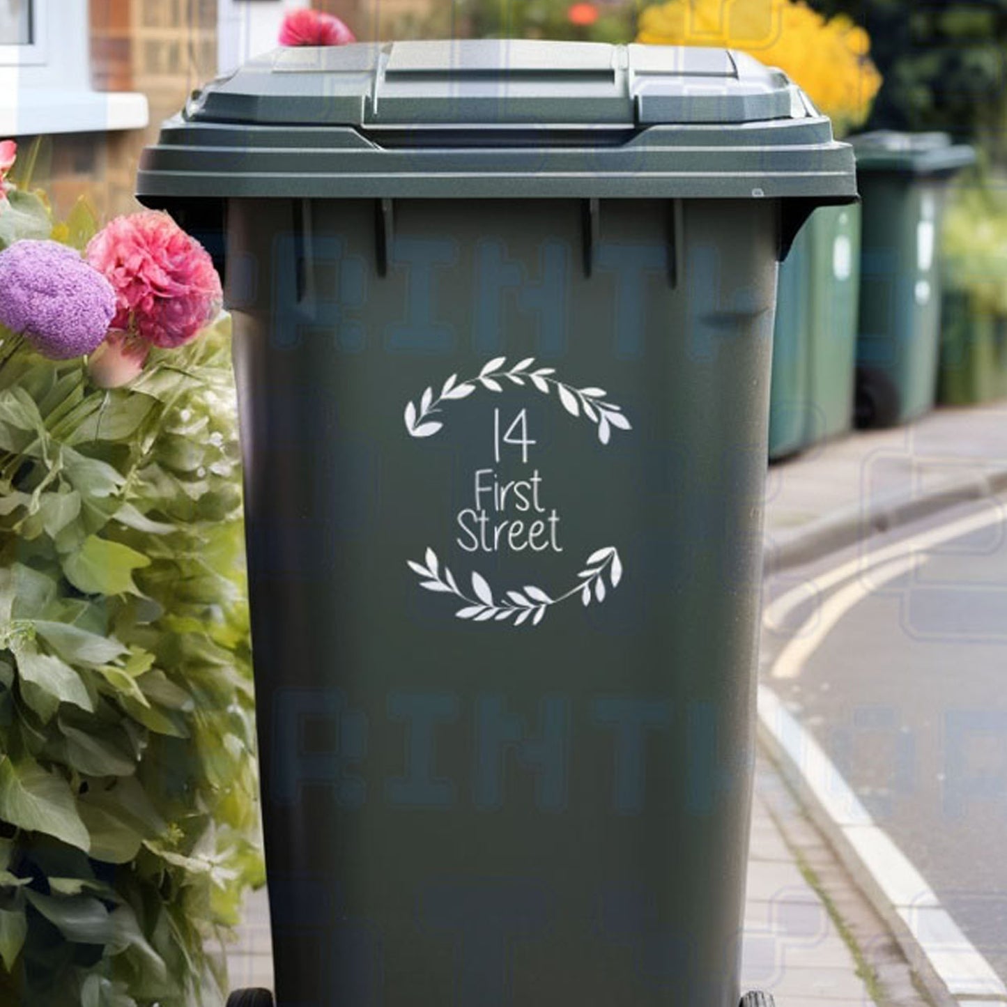 Personalised floral wheelie bin sticker showing leafy wreath design with house number and street name on a bin outside a UK home by Pixel Printworks