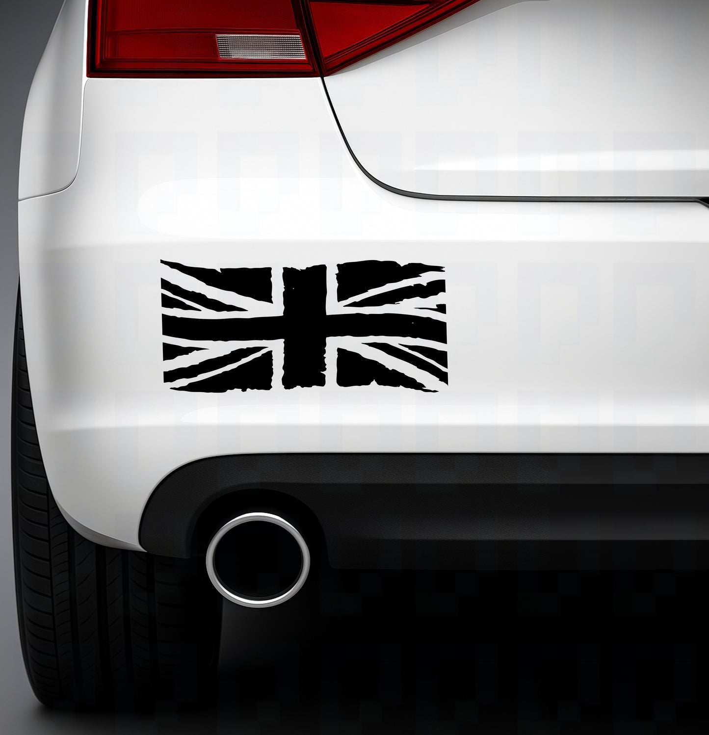 Rugged Union Jack flag vinyl sticker applied to rear of a white car near the exhaust