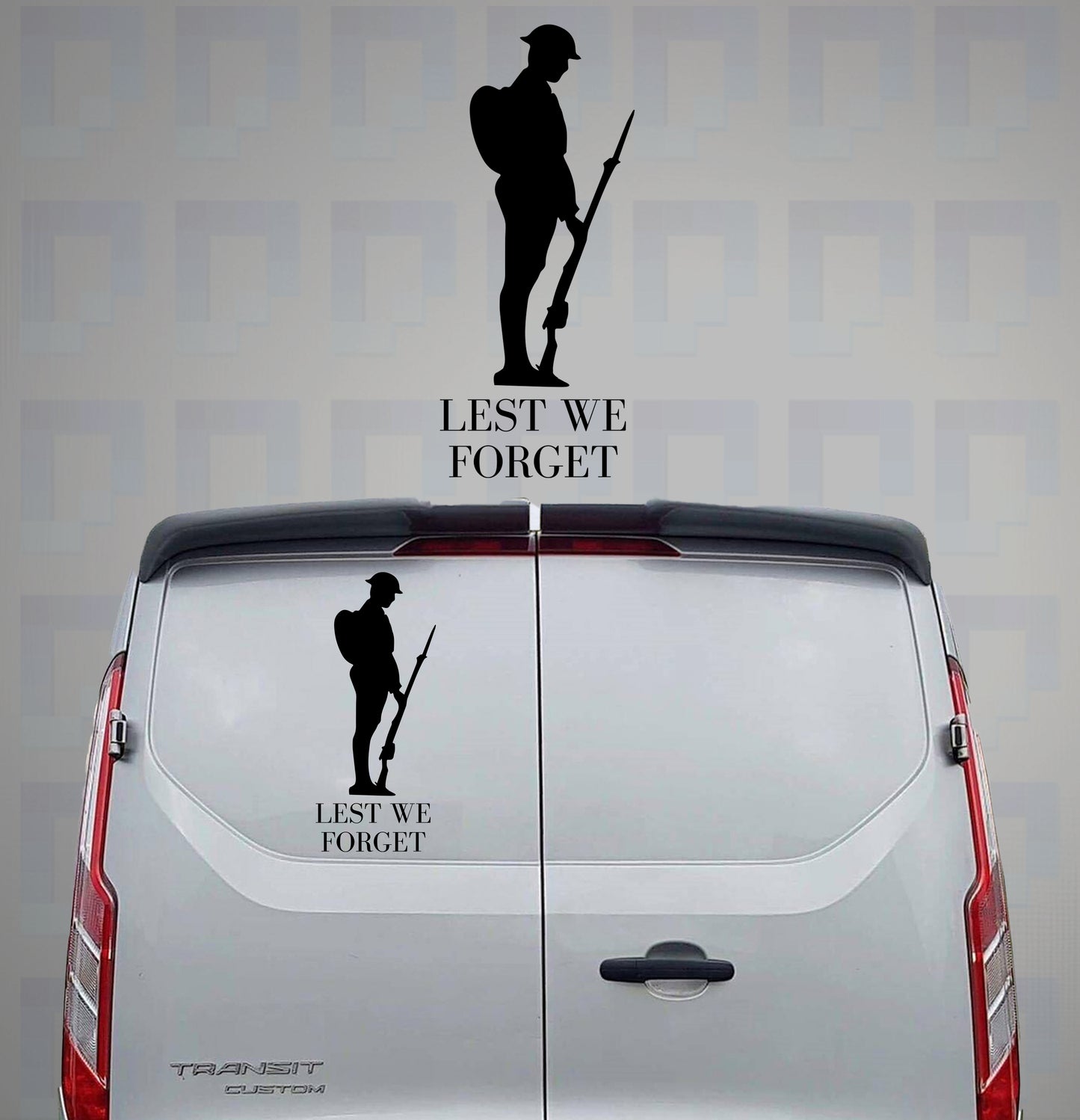 Lest We Forget vinyl decal featuring a single soldier silhouette on the rear of a grey van