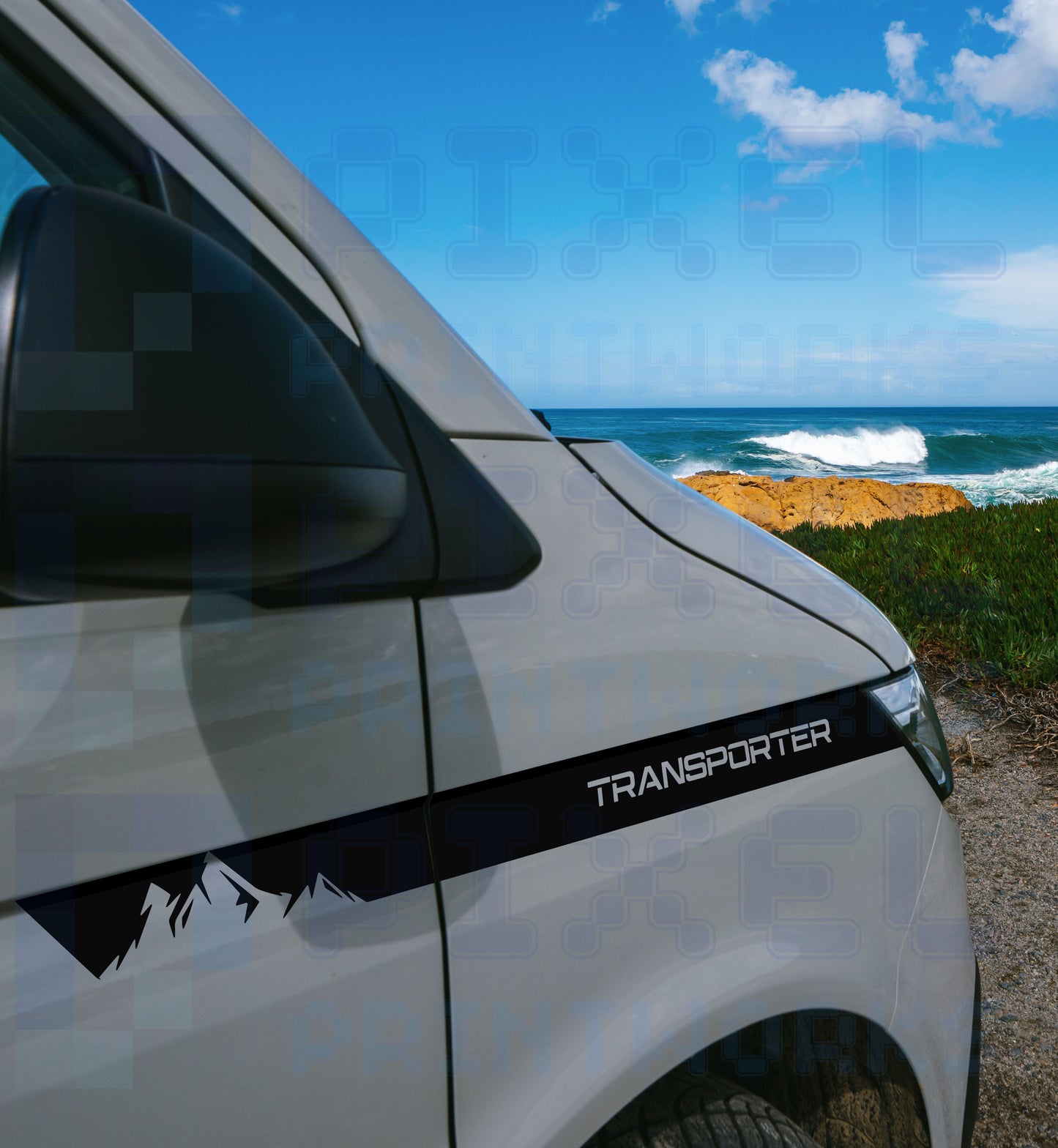 VW Transporter T5 T6 front wing stripe decals with mountain graphic and TRANSPORTER text fitted to light grey camper van by the coast