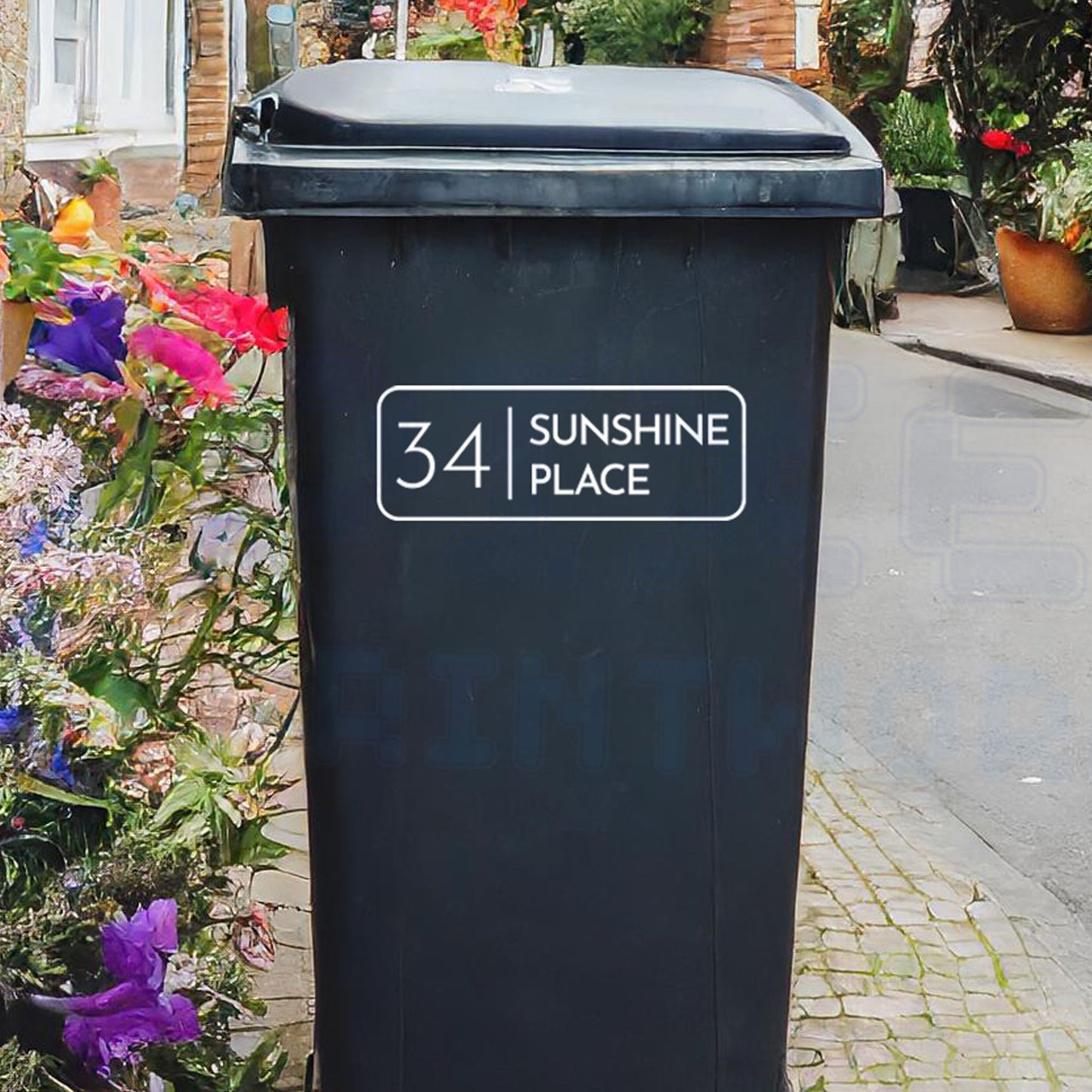 Personalised classic rectangle wheelie bin sticker showing house number and street name in a framed design on a bin outside a UK home by Pixel Printworks