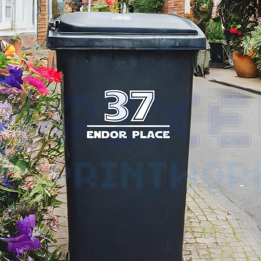 Personalised Jedi-style wheelie bin sticker showing house number and street name in bold sci-fi font on a bin outside a UK home by Pixel Printworks